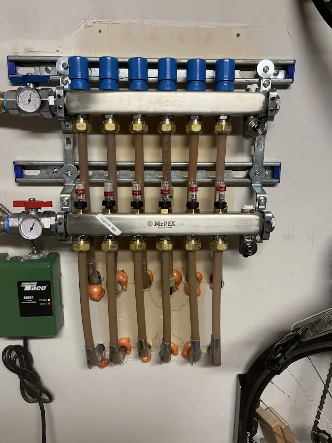 Plumber performing Water Heater Repair at a residential property in Creedmoor